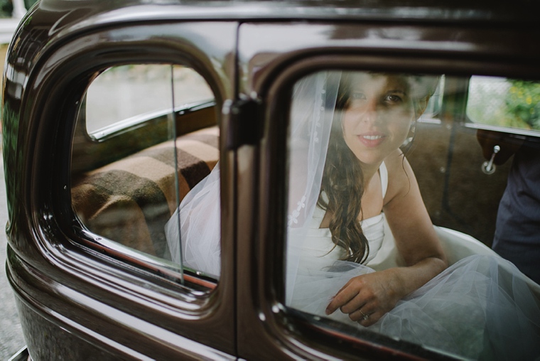 bride looking out of classic car