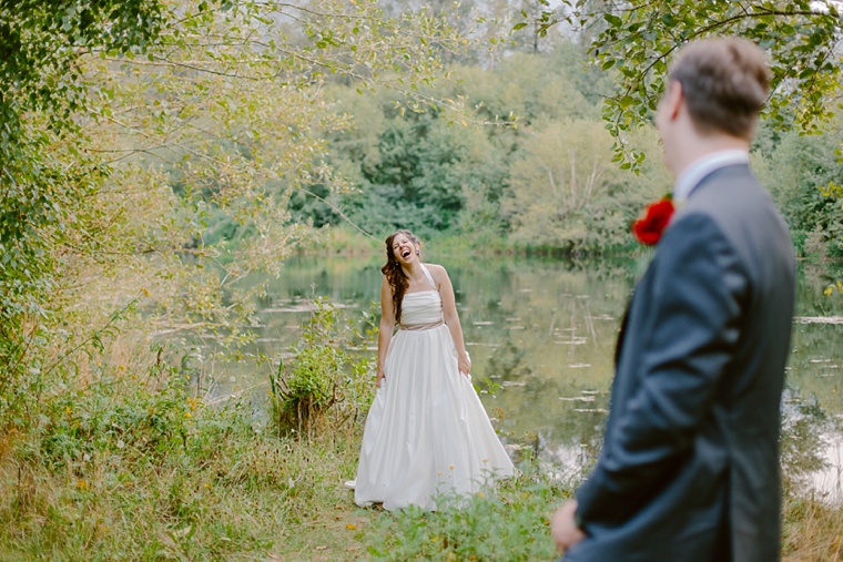 bride laughing in the forest