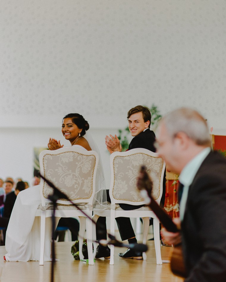 bride and groom laughing during wedding ceremony
