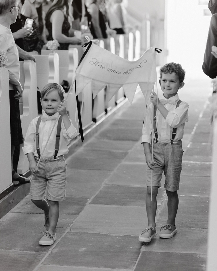 cute ringbearers holding sign