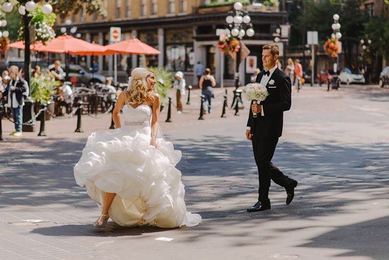 bride and groom crossing the street